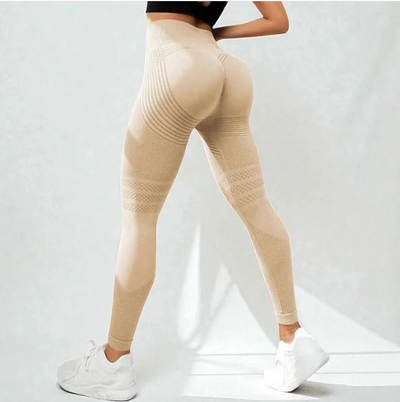 Vista por detrás de las calzas modeladoras Drenalia color Baige, con franjas de relieve bajo los glúteos y en los muslos